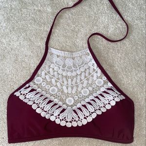Haltered bikini top. Maroon with lace detailing.